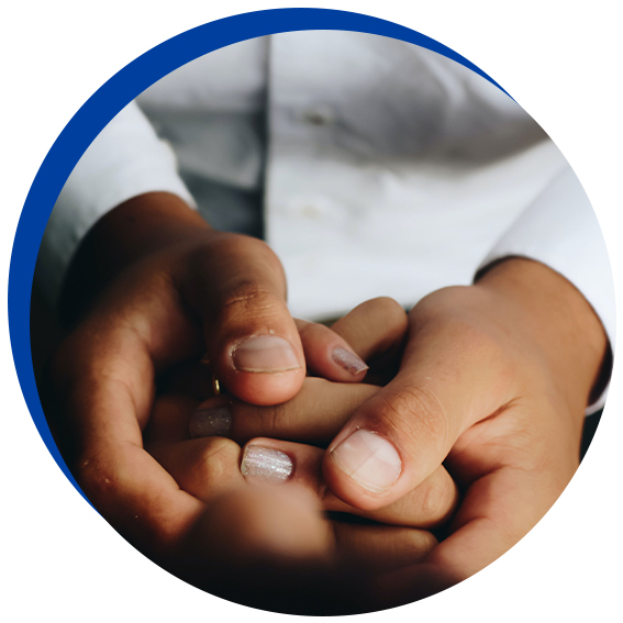 people holding hands reassuredly