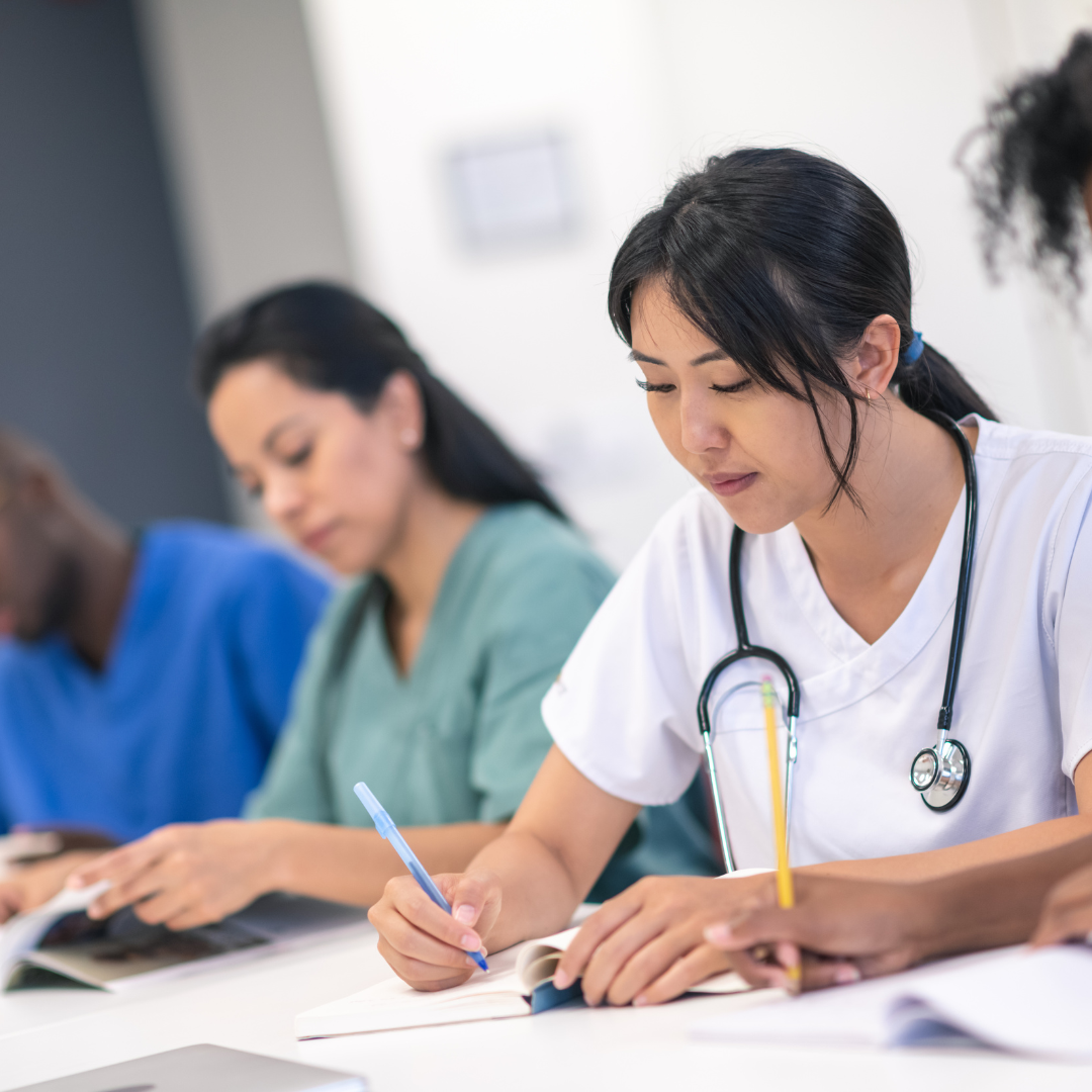 nurses taking notes during a class