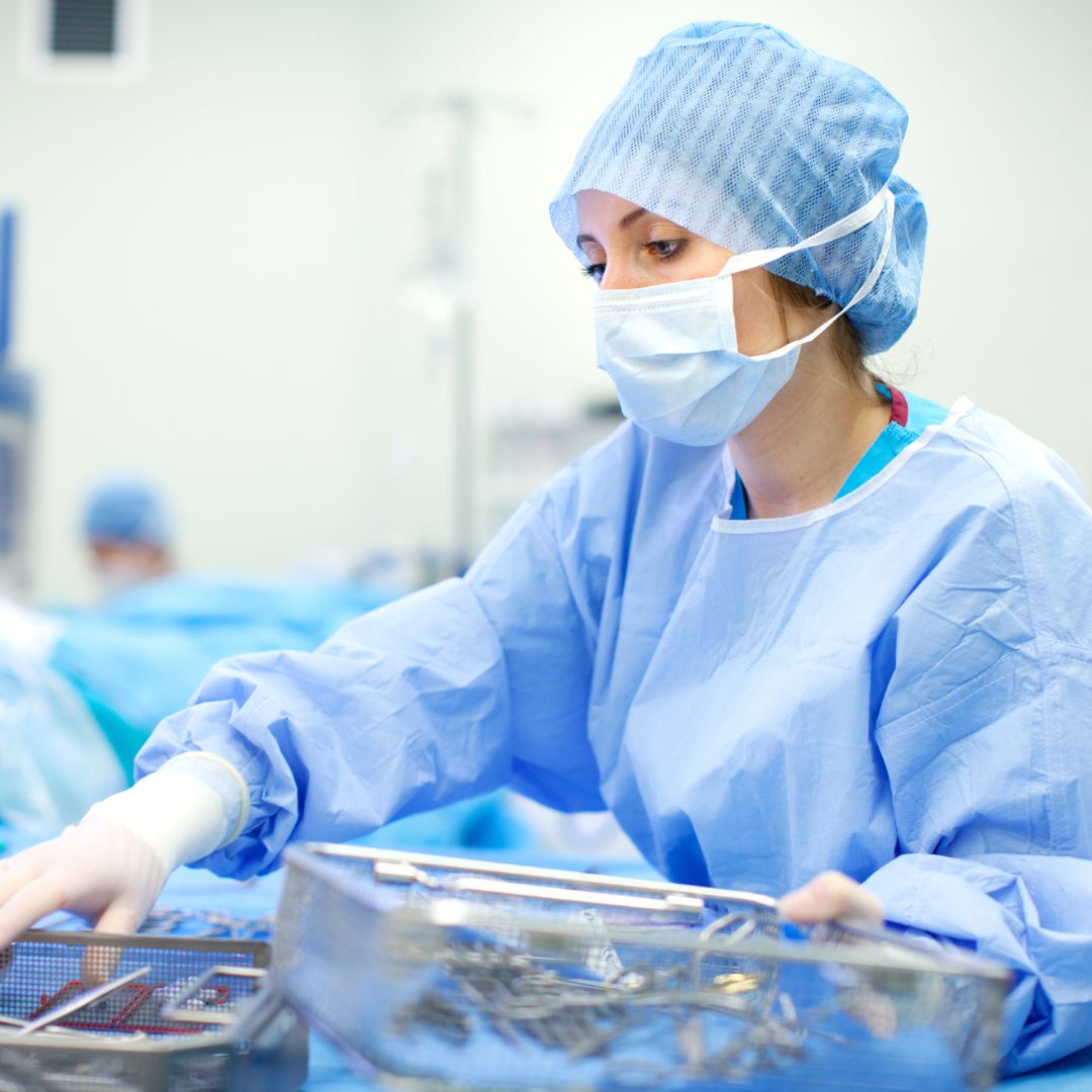 scrub nurse working in an operating room