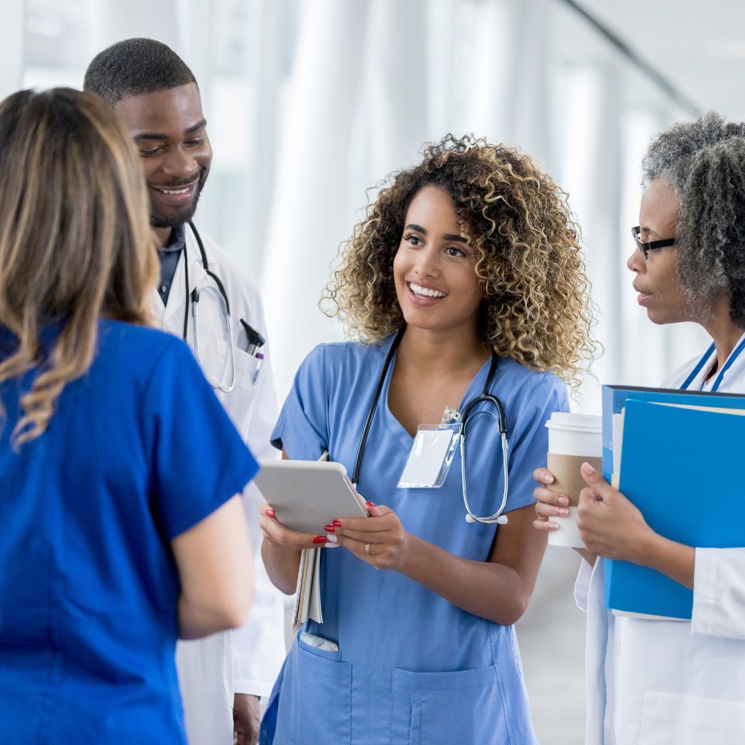 Nurse speaking with healthcare team