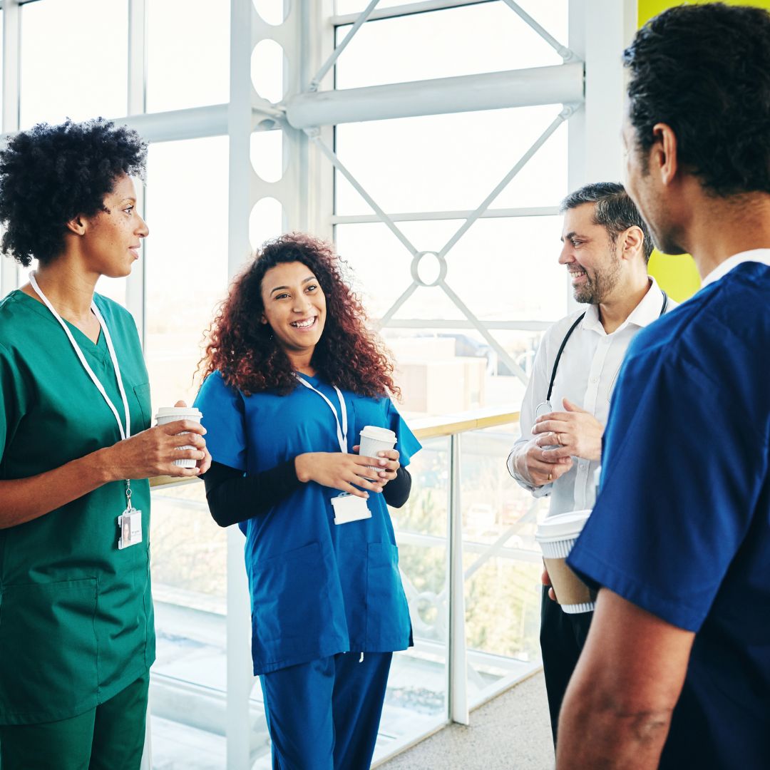 Nurses speaking in group