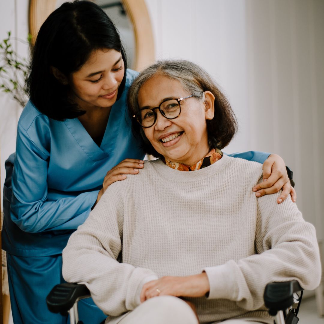 nurse smiling with an old woman