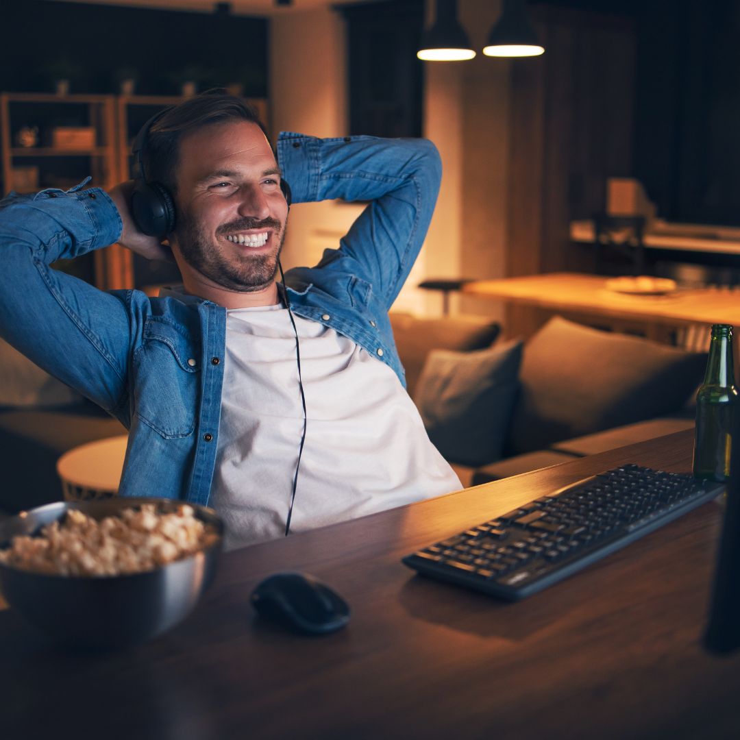 A man watching a movie. 
