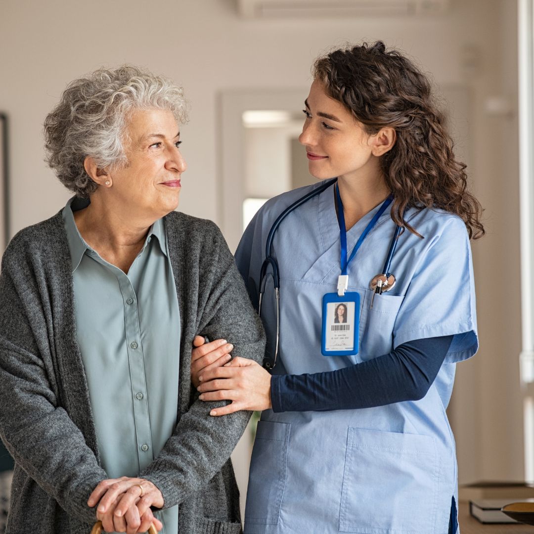 nurse helping woman