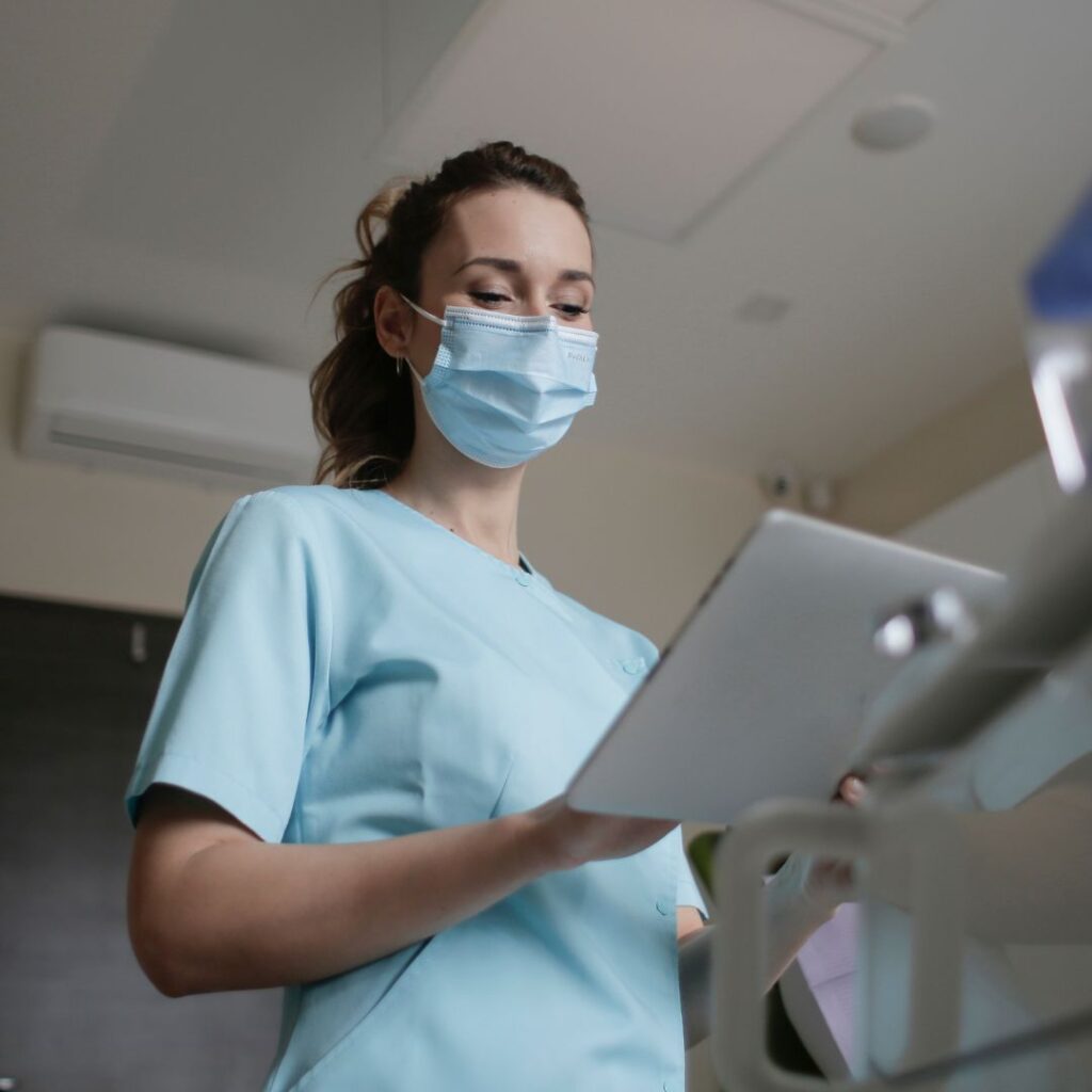 Nurse updating charts