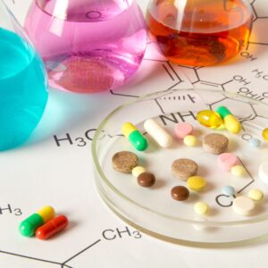 Medications surrounded by vials and their compound names