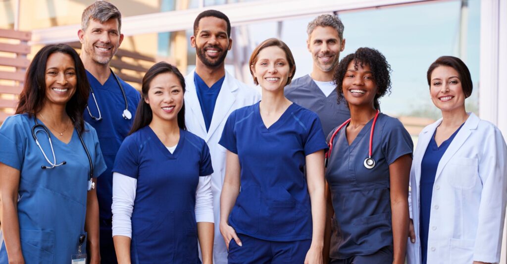 a group of nurses smiling