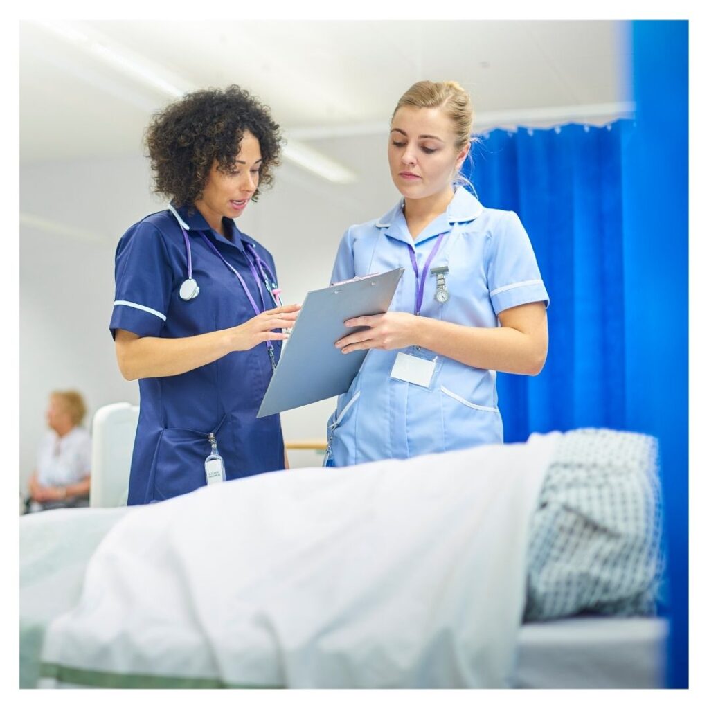 Two nurses discussing about a patient