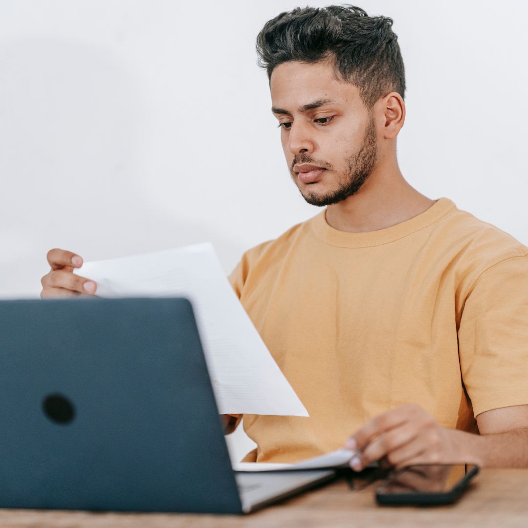 man looking at laptop