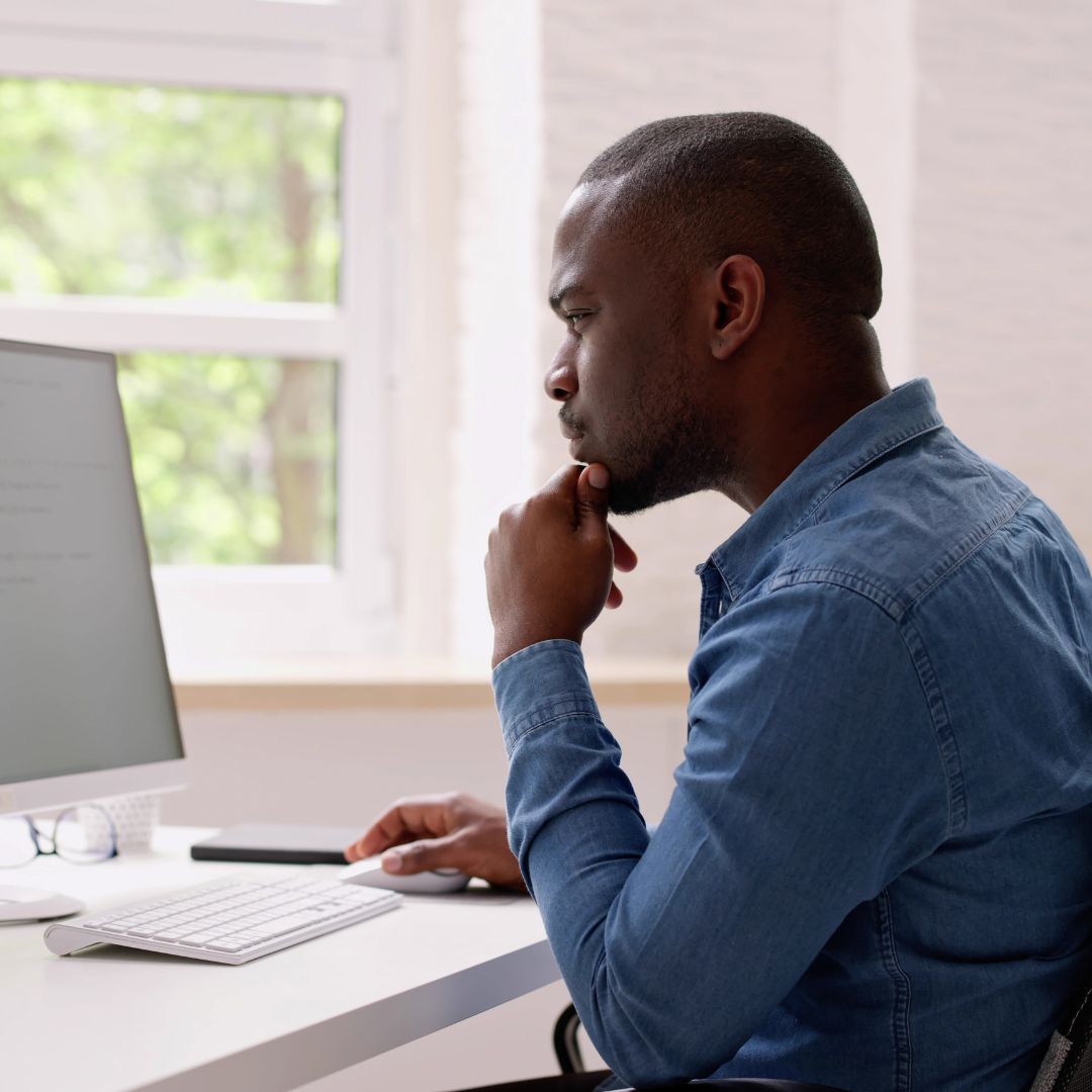 man looking at computer