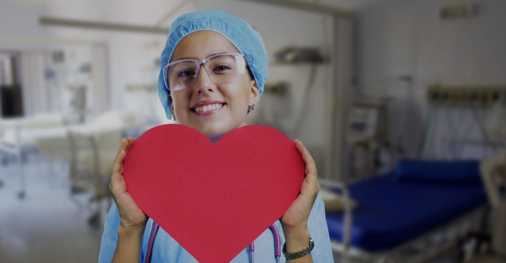 nurse holding heart cutout