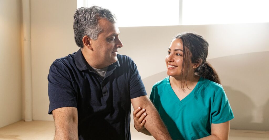 nurse holding patient's arm