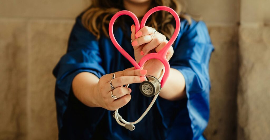 Nurse making heart with stethescope