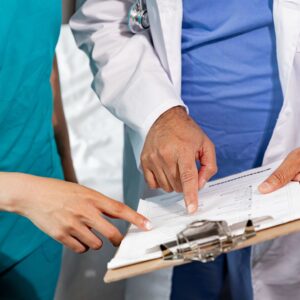 Nurse and doctor going over a chart