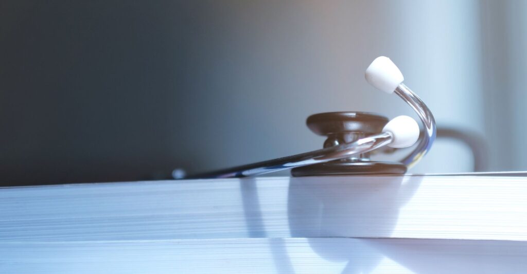 Stethescope on top of textbooks