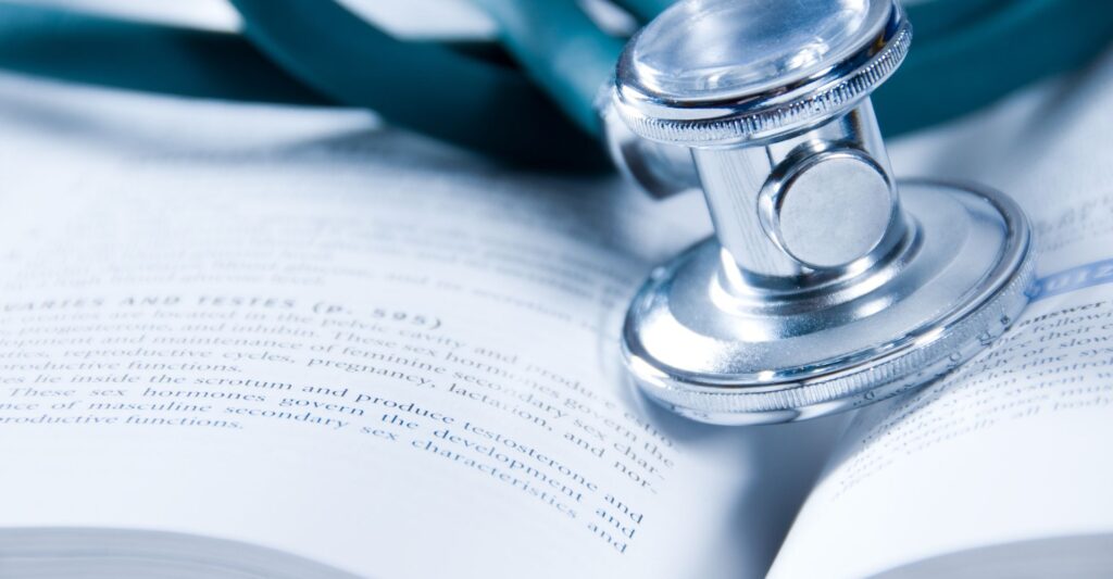 Stethescope on top of textbooks