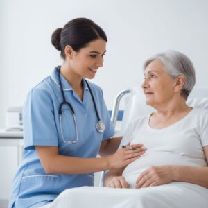 A young female nurse in light blue scrubs and a stethoscope smiles reassuringly at an elderly female patient sitting up in a hospital bed.